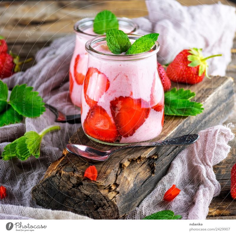 smoothies of fresh strawberries Yoghurt Dairy Products Fruit Dessert Breakfast Diet Beverage Cold drink Spoon Table Wood Eating Dark Fresh Juicy Green Red