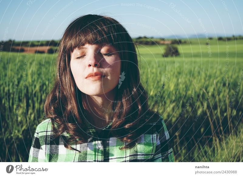 Young woman meditating in nature Lifestyle Style Beautiful Face Healthy Wellness Harmonious Well-being Senses Relaxation Meditation Human being Feminine