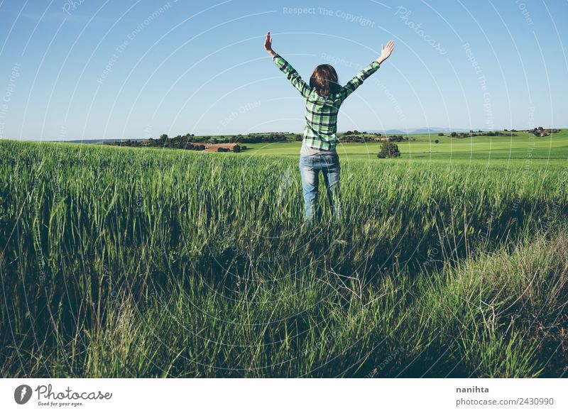 Young woman enjoying a sunny day in a green field Lifestyle Style Joy Healthy Wellness Harmonious Well-being Vacation & Travel Adventure Far-off places Freedom