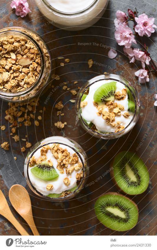 Yogurt Granola and Kiwi Parfait Yoghurt Fruit Dessert Fresh food parfait kiwi Cereal Crunchy oatmeal Almond Dairy healthy Snack sweet Meal layered glass jar