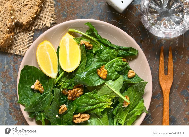 Spinach and Walnut Salad Vegetable Vegetarian diet Fresh food walnut Raw Vegan diet healthy Dish Side Snack Lemon Wedge overhead Horizontal vegan vegetarian