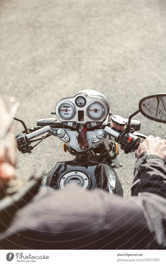 Senior man steering motorcycle on road Vacation & Travel Trip Adventure Mirror Human being Man Adults Hand Transport Street Vehicle Motorcycle Metal Old