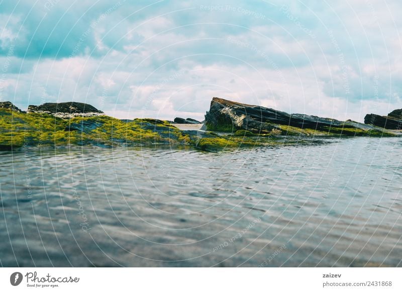 Beach with rocks and puddle in a sunset, ribadeo, lugo, galician, spain Exotic Vacation & Travel Tourism Ocean Island Waves Environment Nature Landscape Sand