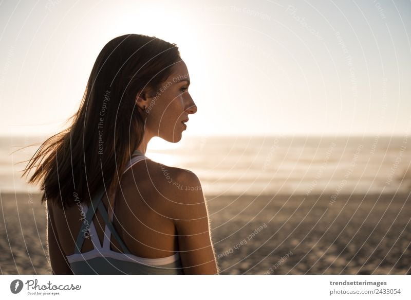 Woman enjoying beautiful sunset on the beach Lifestyle Happy Beautiful Harmonious Relaxation Meditation Vacation & Travel Freedom Summer Sun Beach Ocean Yoga