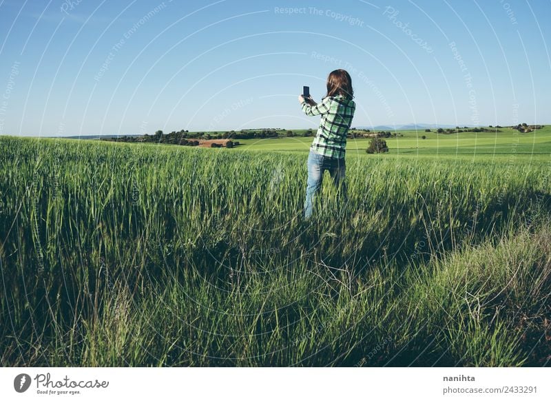 woman taking shots of nature in a green field Lifestyle Style Leisure and hobbies Vacation & Travel Adventure Far-off places Freedom Summer Summer vacation