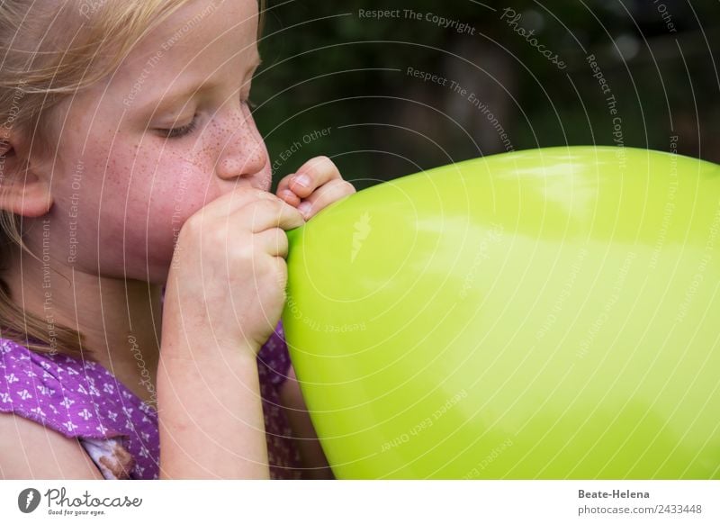 Freckled little girl blows up huge green balloon Leisure and hobbies Playing Adventure Science & Research Child Circus Shows Decoration Balloon Breathe Esthetic