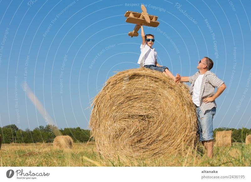 Father and son playing in the park Lifestyle Joy Happy Leisure and hobbies Playing Vacation & Travel Freedom Summer Sun Sports Child Pilot Human being