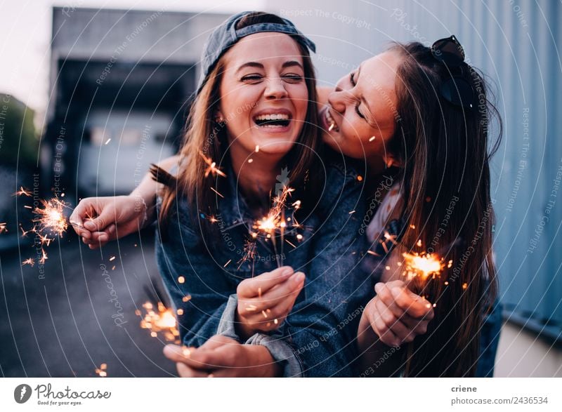 best friends enjoying time together with sparklers Lifestyle Joy Happy Beautiful Summer Feasts & Celebrations Woman Adults Friendship Hand Sunglasses Brunette