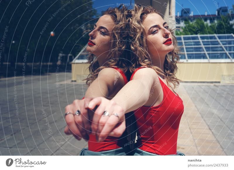 Pretty blonde woman against a mirror wall in street Lifestyle Elegant Style Design Beautiful Hair and hairstyles Harmonious Senses Summer Sun Human being