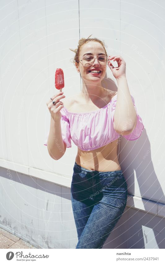 Young blonde woman eating an ice cream in summer Food Ice cream Eating Lifestyle Joy Beautiful Summer Summer vacation Sun Sunbathing Human being Feminine