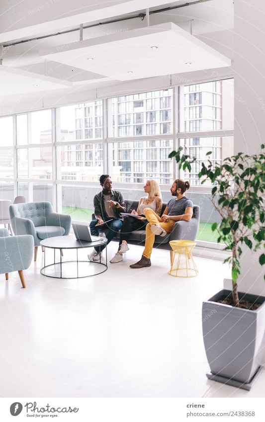 Group of young adults having business meeting in start up office Calm Work and employment Profession Office Business Meeting To talk Computer Notebook