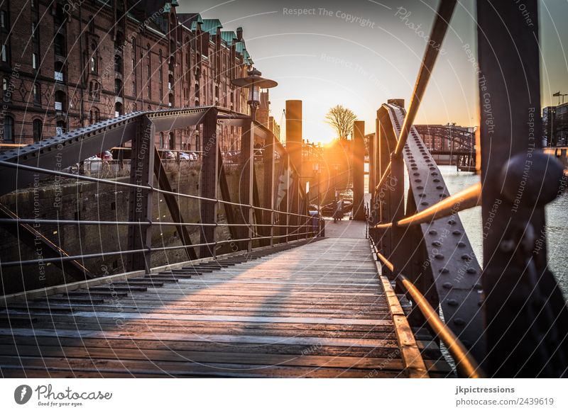 Old bridge in Hamburg Speicherstadt at sunset Twilight Evening Sunset Light Romance Brick Old warehouse district Germany World heritage Water Blue sky