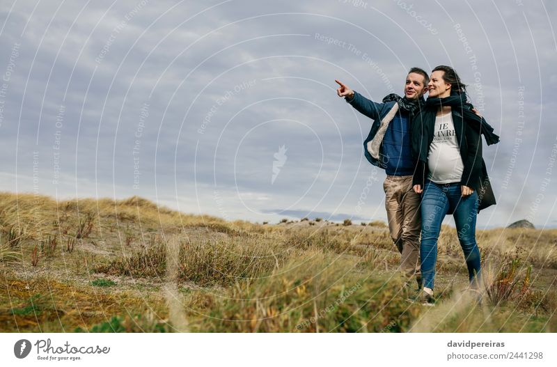 Young couple taking a walk near the coast Lifestyle Happy Winter To talk Human being Woman Adults Man Mother Family & Relations Couple Nature Landscape Autumn