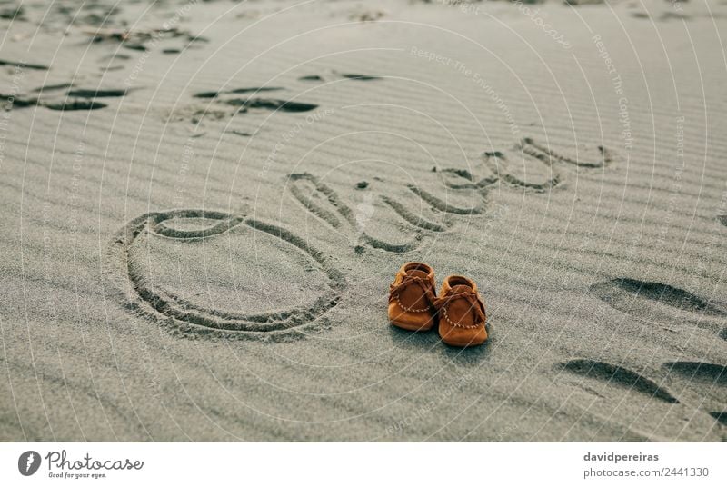 Baby name written in sand with shoes Design Beautiful Vacation & Travel Tourism Beach Boy (child) Man Adults Nature Sand Coast Footwear Write Natural Brown Name