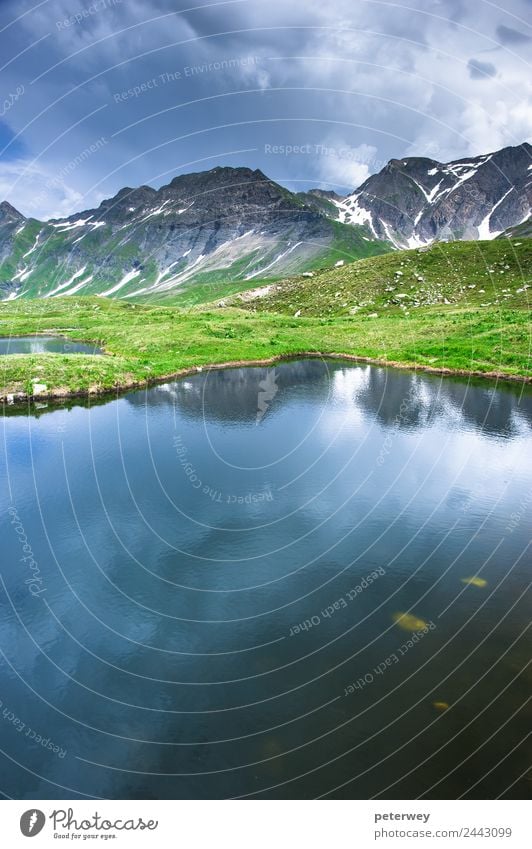 Small mountain lake in Greina valley, Ticino, Switzerland Tourism Trip Nature Storm clouds Mountain Lake Hiking Blue Gray Green Alpine alps grass greina high