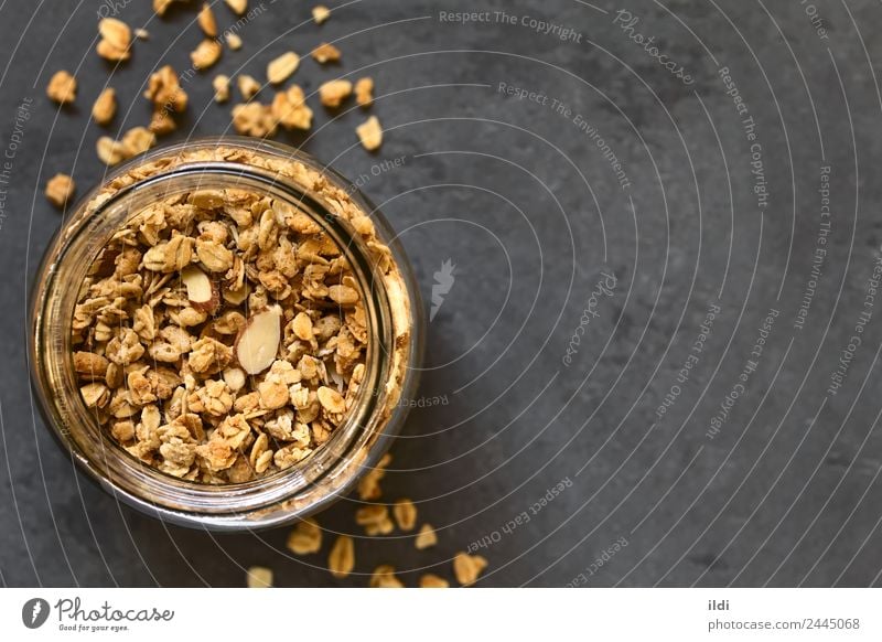 Crunchy Granola Grain Dessert Nutrition Breakfast Natural food Cereal crispy oat oatmeal flakes Almond sweet Snack healthy Meal glass jar Slate Horizontal