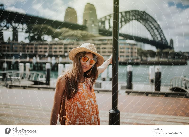 Young woman with hat and sunglasses posing in Sydney with Harbour Bridge in the background. Lifestyle Joy Vacation & Travel Trip City trip Summer Human being