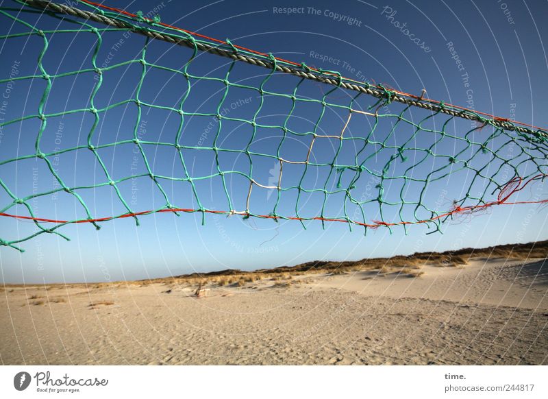 Spiekeroogpochtplatz. Beach Sand Sky Signs and labeling String Net Old Tall Broken Volleyball net Torn Defective Diagonal Volleyball court Gust of wind Shabby