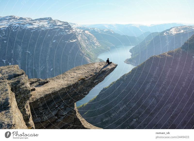 Trolltunga in Norway Masculine Environment Nature Landscape Plant Elements Earth Cloudless sky Beautiful weather Snow Rock Mountain Glacier Sit Exceptional Firm