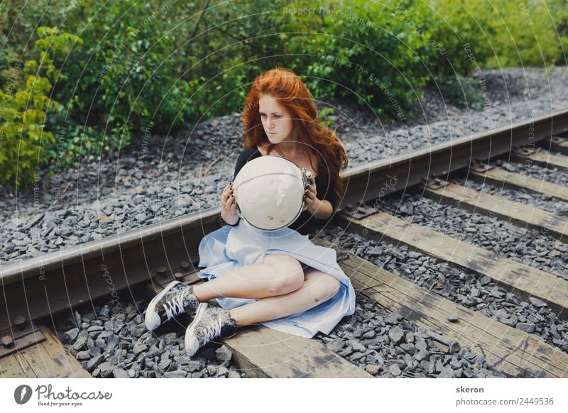 girl in the helmet of an astronaut walking on the rails Feminine Young man Youth (Young adults) 1 Human being 18 - 30 years Adults Culture Youth culture