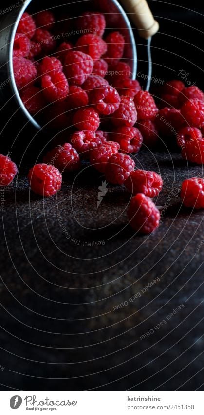 Fresh raspberries in a small metal bucket Fruit Dessert Nutrition Breakfast Vegetarian diet Diet Summer Dark Natural Pink Red Black background Berries colorful