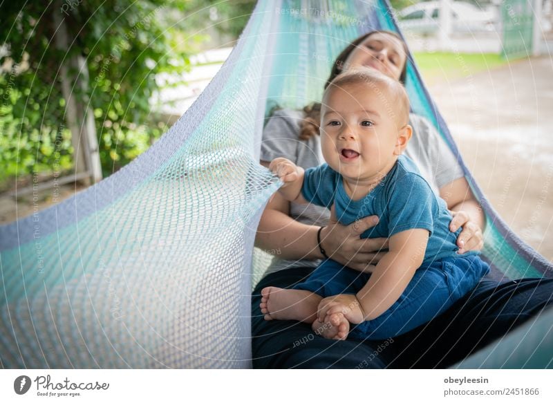 The little boy and mother are sitting at the hammock Lifestyle Joy Happy Beautiful Playing Child Human being Baby Woman Adults Parents Mother Family & Relations