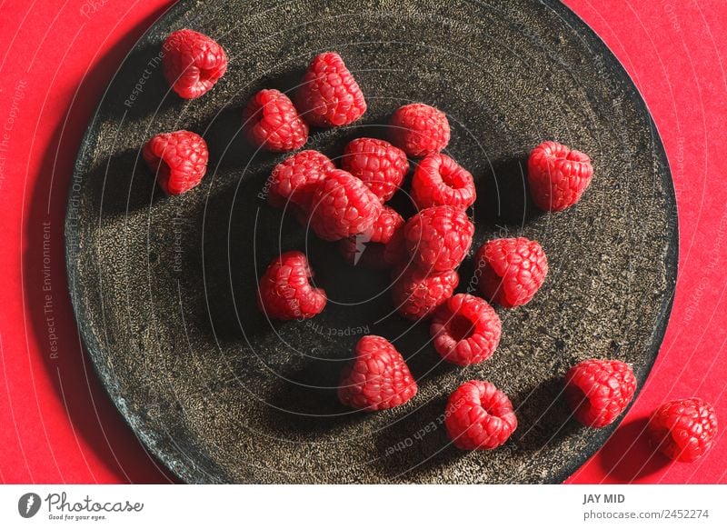 Fresh raspberries on rustic black plate Raspberry Plate Grunge Fruit Black Mature Healthy Eating Natural Organic Berries Red Nutrition Diet Ingredients Raw