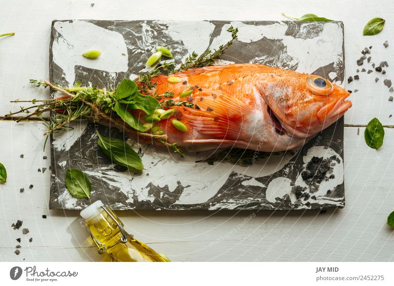 Raw red scorpion fish on marble table. Scorpion fish Cooking Fish Food Ingredients Herbs and spices Stone slab Nutrition Orange Rosemary Healthy Eating