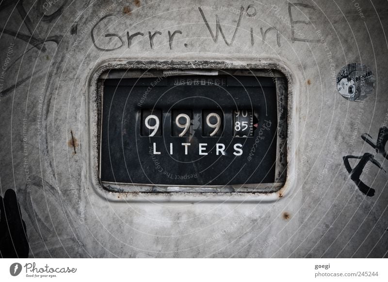 A bottomless barrel Petrol station Transport Petrol pump Characters Digits and numbers Energy Climate Sustainability Thrifty Environmental pollution Meter