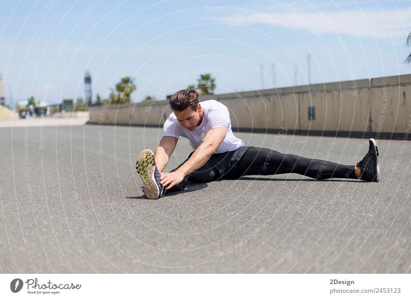 Athlete at the city park warming and stretching Lifestyle Relaxation Sports Human being Masculine Young man Youth (Young adults) Man Adults 18 - 30 years Bridge