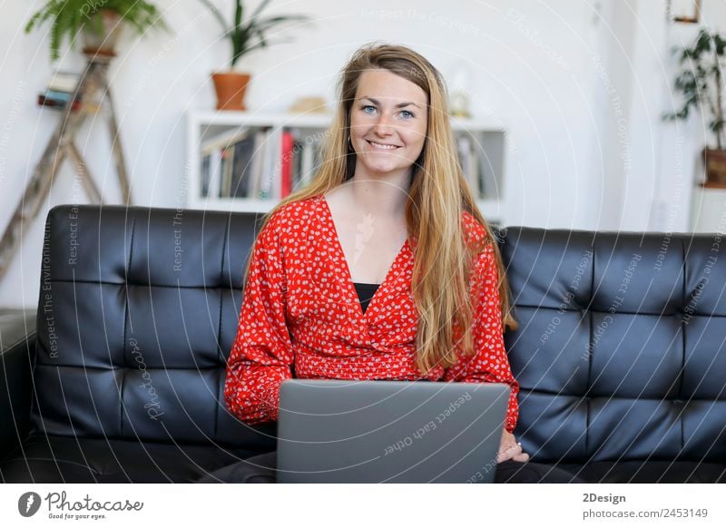 Entrepreneur woman wearing red shirt working with a laptop sitting on a couch at home Shopping Happy Beautiful House (Residential Structure) Sofa School Study