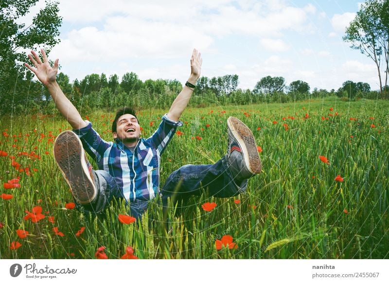 Young happy man having fun in a field of green wheat Lifestyle Joy Healthy Wellness Contentment Human being Masculine Young man Youth (Young adults) Man Adults