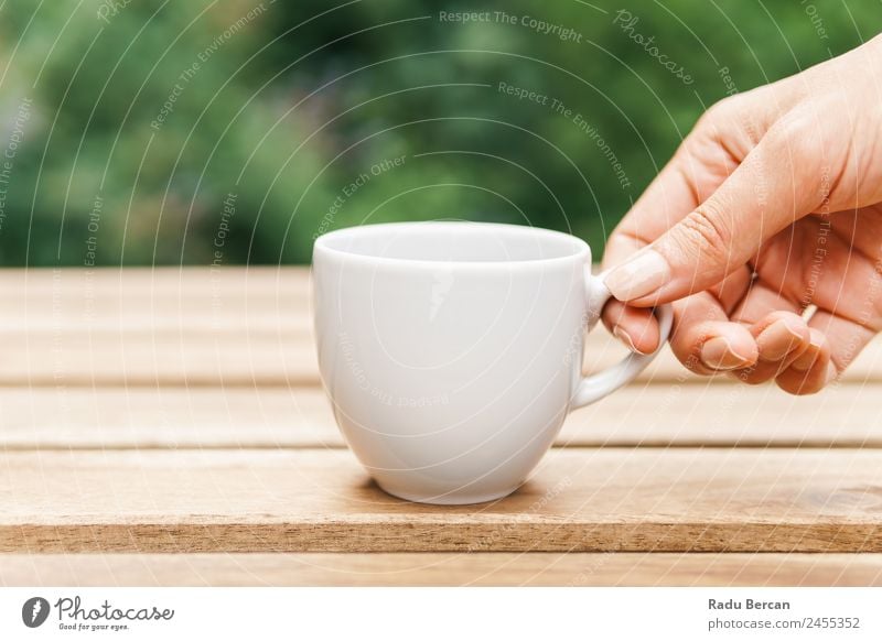 Woman Hand Raising A Cup Of Coffee From Wooden Table In Garden Background picture Green Breakfast Morning Café Light White Drinking Espresso Food Hot Beverage