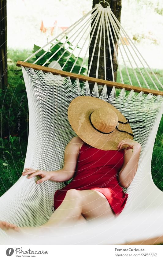 Young woman relaxing in a hammok Feminine Youth (Young adults) Woman Adults 1 Human being 18 - 30 years 30 - 45 years Relaxation Hammock Sunhat Shadow Summer