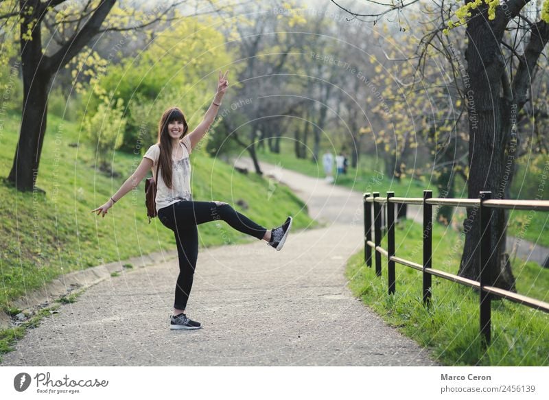 beautiful young woman having fun outside in park Lifestyle Style Joy Happy Beautiful Hair and hairstyles Healthy Well-being Relaxation Model-making