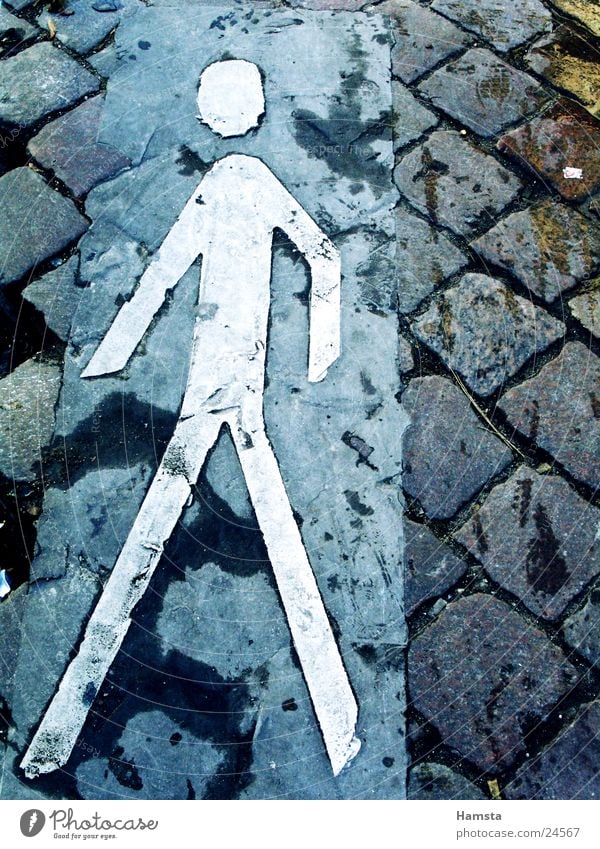 sidewalk Pedestrian Curbside Sidewalk Pictogram Going Traverse Exterior shot Town Historic Walking Sign Street Paving stone