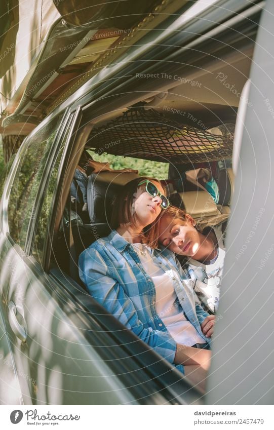 Tired women friends sleeping inside of car Lifestyle Beautiful Relaxation Leisure and hobbies Vacation & Travel Trip Adventure Human being Woman Adults