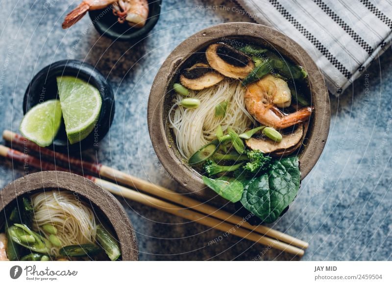 Bowl of Asian Noodle Soup with chopsticks Vegetable Stew Herbs and spices Lunch Dinner Table Pack Hot noodle spaguetti Thai fish asian shrimp miso Mushroom lime