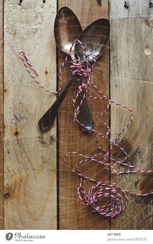 vintage metal spoons, on wooden background Spoon Design Table Restaurant Tool Rope Collection Wood String Old Glittering Funny Retro Brown White Creativity