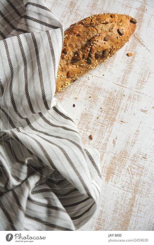 rustic bread, wrapped in striped fabric Food Bread Breakfast Organic produce Diet Group Fresh Brown White Tradition breads loaf of bread corn seeded bread