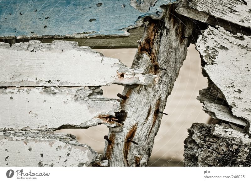 ailing - the sea Fishing boat Dinghy Wood Old Dirty Broken Trashy Derelict Blue White Hollow Opening Brittle Transience Fragment Colour photo Subdued colour