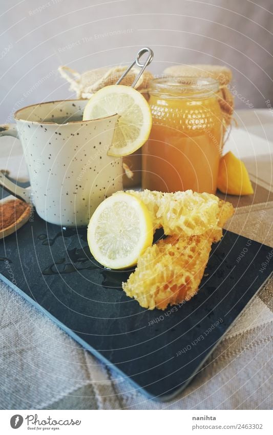 Tea, honey and lemon breakfast Food Fruit Herbs and spices Lemon Honey Honeycomb Nutrition Eating Breakfast Organic produce Vegetarian diet Beverage Hot drink