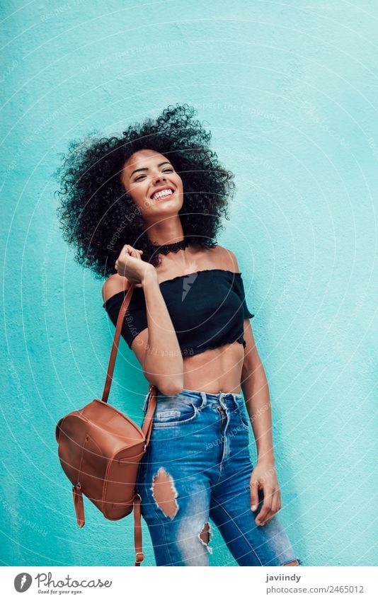 Happy mixed woman with curly hair standing on the street Joy Beautiful Hair and hairstyles Human being Feminine Young woman Youth (Young adults) Woman Adults 1