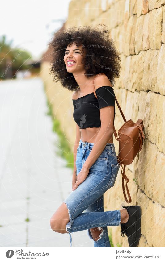 Happy mixed woman with afro hair laughing outdoors Lifestyle Style Joy Beautiful Hair and hairstyles Face Human being Young woman Youth (Young adults) Woman