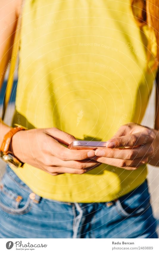 Young Woman Checking Her Mobile Phone Telephone Hand PDA Hold Solar cell Close-up using Internet Smart Technology Communication Social Human being Lifestyle