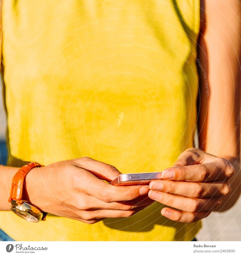 Young Woman Checking Her Mobile Phone Telephone Hand PDA Hold Solar cell Close-up using Internet Smart Technology Communication Social Human being Lifestyle