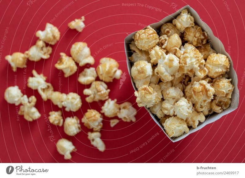 Sweet popcorn Grain Candy Entertainment Feasts & Celebrations Packaging Fragrance Fresh Red Popcorn Cinema Paper bag Colour photo Interior shot Studio shot