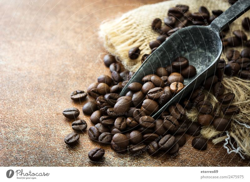 Roasted coffee beans and spoon Food Grain Nutrition Breakfast Organic produce Vegetarian diet Diet Beverage Coffee Espresso Spoon Brown Addiction Beans