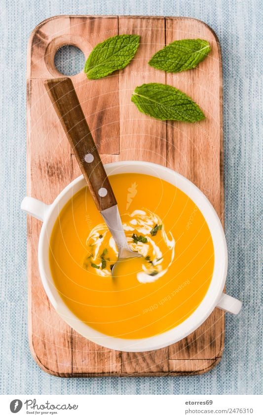 Pumpkin soup in white bowl Food Vegetable Soup Stew Nutrition Eating Dinner Organic produce Vegetarian diet Diet Hot drink Bowl Spoon Natural Blue Green Orange