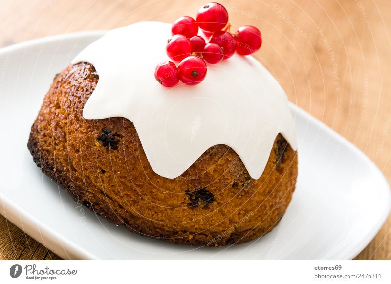 Christmas pudding on wooden table Food Fruit Cake Dessert Candy Nutrition Christmas & Advent Brown Red White Pudding Food photograph Tradition Home-made Seasons